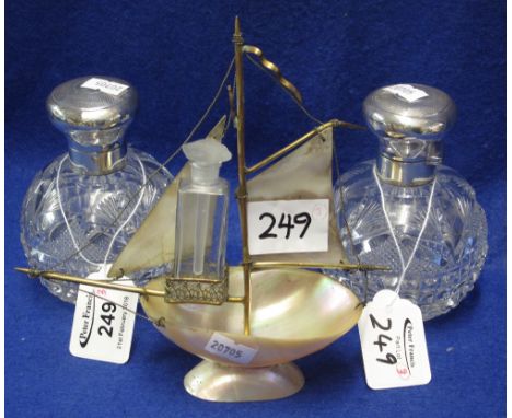 Pair of crystal glass silver Mappin and Webb globular scent bottles, both with internal stoppers, together with mother-of-pea