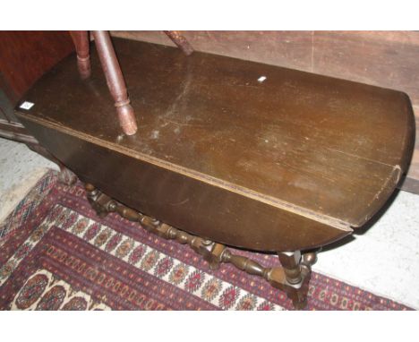 Reproduction oak low gate legged table. (B.P. 24% incl. VAT)