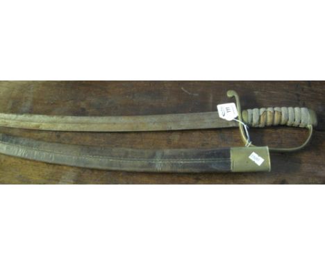 19th Century British Naval cutlass, having shark skin grip and brass hilt, single edge fullered blade in a brass mounted leat