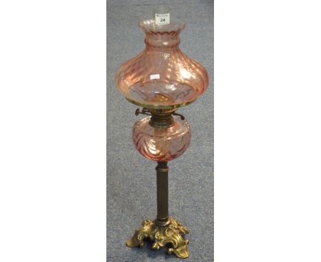 Early 20th Century brass Duplex double burner oil lamp with pale pink reservoir and shade, with clear funnel.(B.P. 24% incl. 