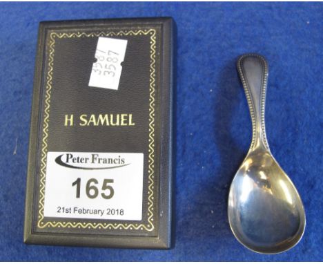 Silver caddy spoon, Birmingham, 1930, maker's mark: A.M & Co., in associated box.(B.P. 24% incl. VAT)