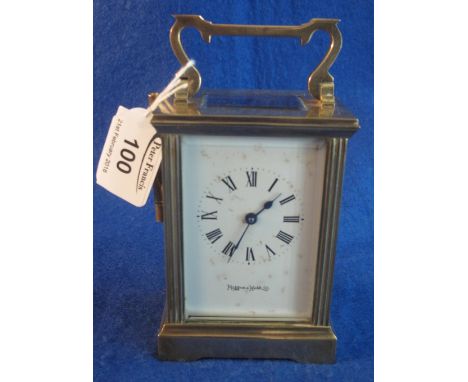 Mappin and Webb brass carriage clock with full depth Roman enamel dial, with key.(B.P. 24% incl. VAT)