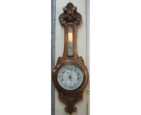 Good quality carved oak aneroid barometer.(B.P. 24% incl. VAT) 
