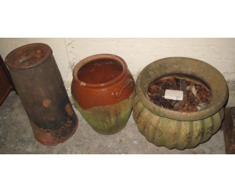Collection of garden furniture to include: terracotta chimney stack; glazed terracotta two handled baluster planter and a com