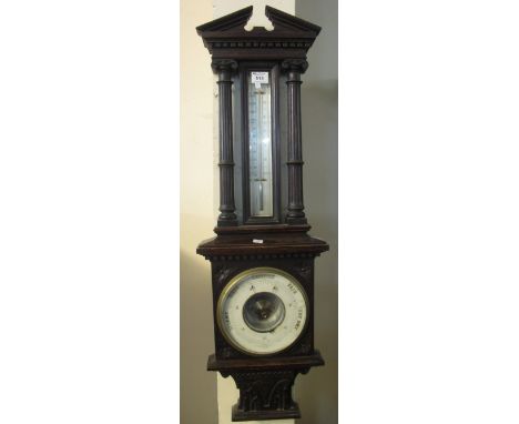 Early 20th Century carved oak barometer.(B.P. 24% incl. VAT)