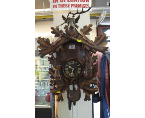 Bavarian wooden animal decorated Cuckoo clock with weights and pendulum.(B.P. 24% incl. VAT)