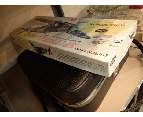 Toplite case with cameras with a Supermarine Spitfire construction model
