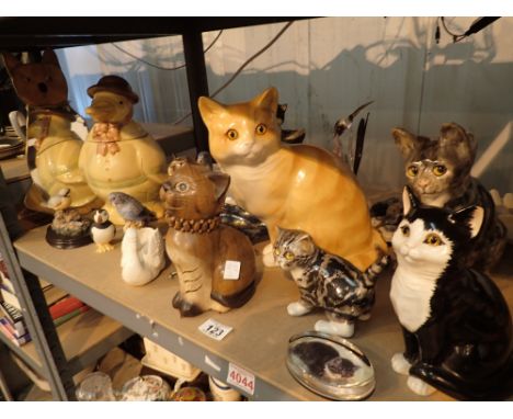 Shelf of ceramic cats with glass eyes owl and budgie figurines etc