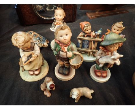 Six Goebel figurines and a collection of Wade CONDITION REPORT: Most pieces have minor expected chips to extermities 