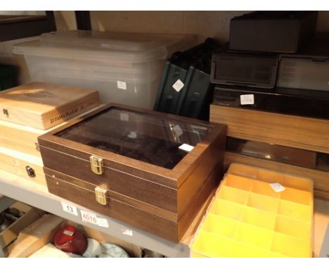 Shelf of assorted wood and plastic small storage and display boxes