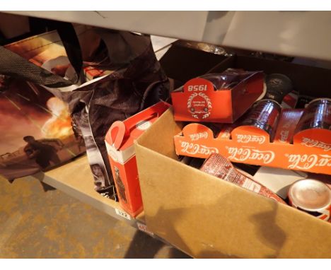 Shelf of mainly Coca-Cola related and alcohol advertising glassware in retail packaging