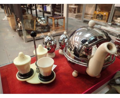 English ceramic teapot with chromed cover and ball feet matching egg warmer etc