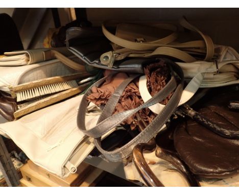 Shelf of ladies vintage handbags and umbrellas 