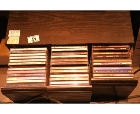 Three drawer CD unit containing four varied selections of CDs including Cher, the Cranberries and more. Not available for in-