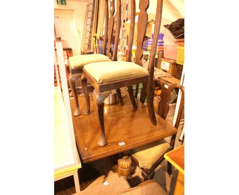 Oak draw leaf extending table and a set of four mahogany high back dining chairs with cabriole legs. Not available for in-hou