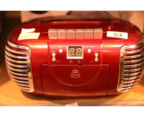 Red 3 in 1 FM/AM radio, CD and cassette player, boxed GPO PCD299. Not available for in-house P&PCondition Report: This item w