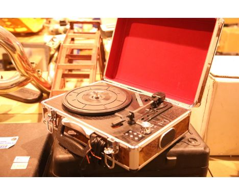 Walnut effect briefcase 3 speed turntable; USB recored in built in twin stereo speakers; RCA connectors and USB port for reco
