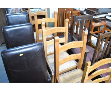 Four rush seated ladder back dining chairs