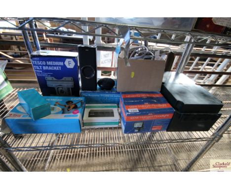 A quantity of boxed items including a blood pressure monitor; TV bracket; halogen flood light; waterproof connecting box etc
