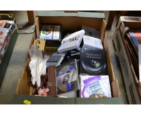 A box containing CDs, mantel clock, wireless activity tracker etc