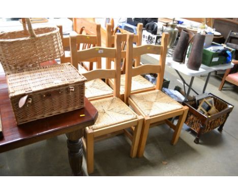 Four rush-seated ladder back chairs