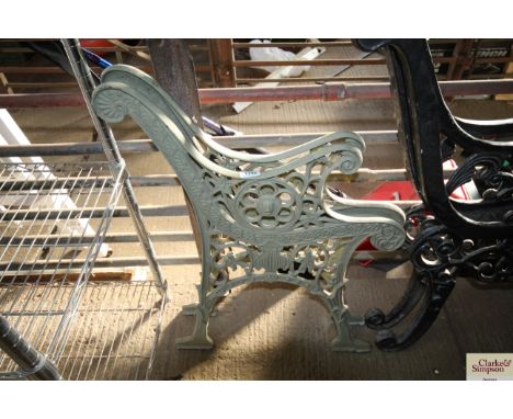 A pair of ornate garden bench ends