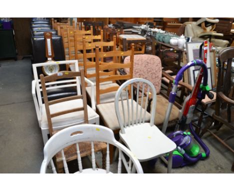 Four pine ladder back chairs and a painted stick back chair