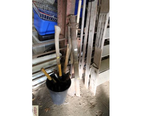 A bucket of hand tools; acrow prop etc