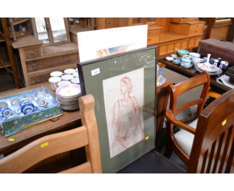 A watercolour study of a continental street scene and a framed portrait