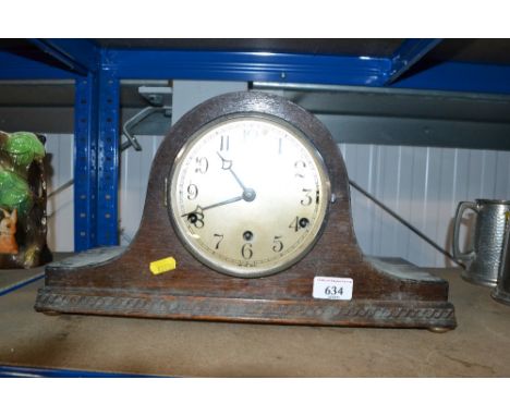 An oak three hole mantel clock