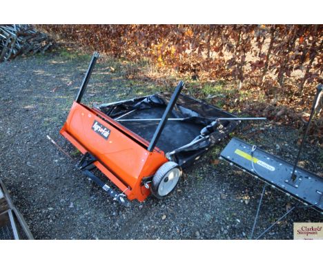 An Agri-Fab trailed garden leaf sweeper with instruction manual