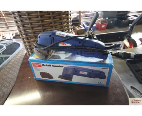 A electric detail sander