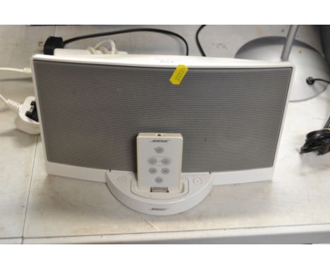 A Bose i-Pod speaker with remote control