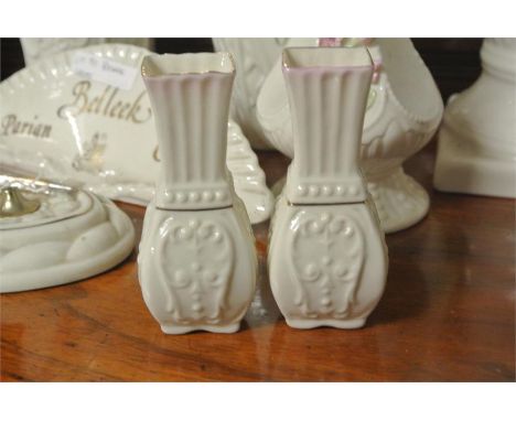 BELLEEK/CERAMIC/IRISH: A pair of stylish Belleek small vases with panelled sides. Cream with a pink blush trim. Each measures