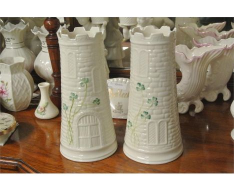 BELLEEK/CERAMIC/IRISH: A pair of delightful Belleek castle/tower form vases with green shamrock motifs Measure approx. 7.75''