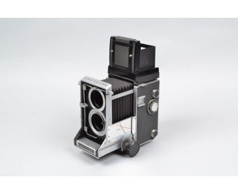 A Mamiya C33 Professional TLR Camera Body, serial no H 319170 R, body G, light scratches, small ding to base, slight lifting 