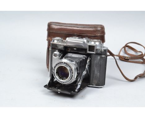 A Zeiss Ikon Super Ikonta 533/16 Rangefinder 6 x 6cm Folding Camera, mid 1950s model, white marks to leatherette, peeling fro