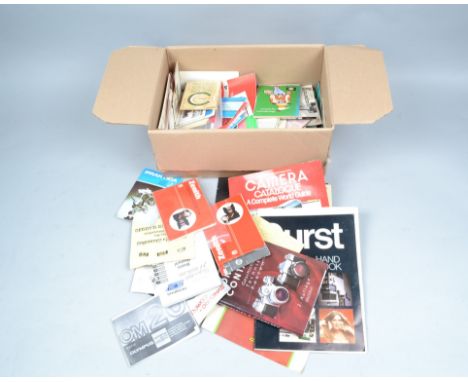 A Box of Camera Literature, items include a book on the history of Contaflex and Contarex (German text), manufacturers' broch