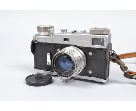 A Gomz Leningrad Rangefinder Camera, four screw edition, with spring wound motor drive, shutter working, rangefinder, viewfin