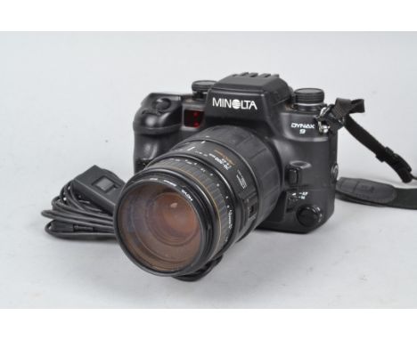 A Minolta Dynax 9 SLR Camera, powers up, shutter fires, AF working, otherwise untested, body G, with Sigma 70-300mm f/4-5.6 A