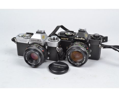 Two Minolta XD 35mm SLR Cameras, an XD5 camera with an MD Rokkor 45mm f/2 lens and a black XD7 camera with an MD Rokkor 50mm 