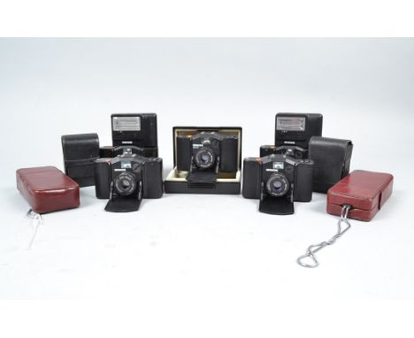 Minox Cameras, two Minox 35 GT, two 35 EL, one 35 GL, two 110 S, in red case, with FC 35 (3) and FC-E flash units, untested