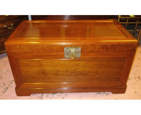 CHINESE TRUNK, camphorwood lined with a rectangular hinged top enclosing a sliding tray, 103cm W x 56cm H x 55cm D.