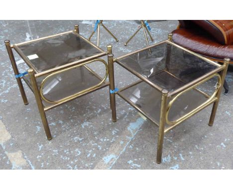 LAMP TABLES, a pair, brass tubular frames with square smoked glass top and lower tier, 50cm x 50cm H. (2)