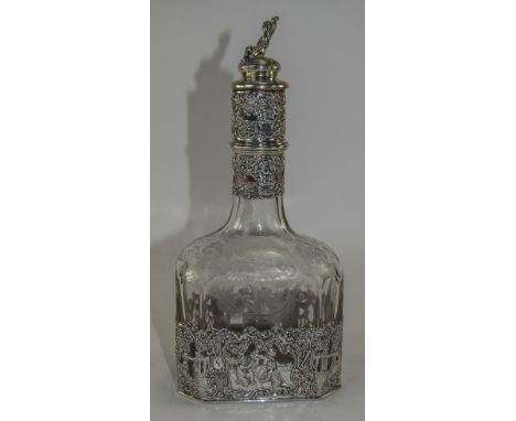 A Very Fine German - Late 19th Century Silver Mounted and Applied Etched Glass Decanter. The Figural Stopper of a Seated Youn