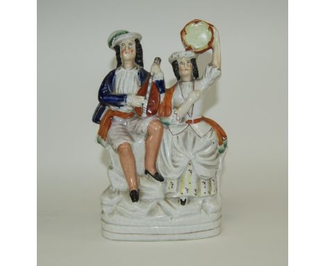 Mid 19th Century Staffordshire Figure - Man and Woman Playing Musical Instruments, Sitting on a Rocky Mount. 9.25 Inches High