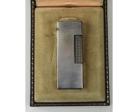 Dunhill Silver Cased Petrol Lighter with Original Box. U.S. Reg 24153. 2.5 Inches High. Nice Condition and Working. 