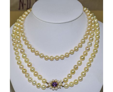 Double Strand Cultured Pearl Necklace With 9ct Yellow Gold Clasp, Set With A Central Amethyst Surrounded By Pearls. Together 