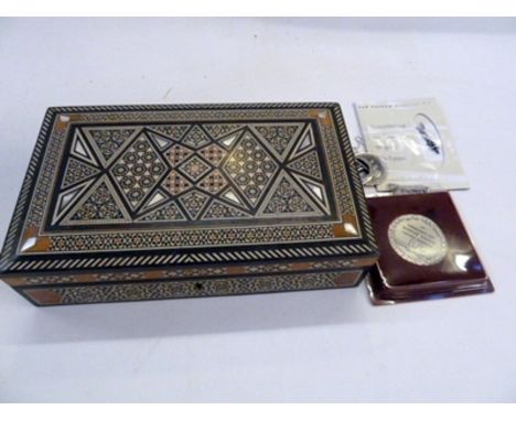 An inlaid ivory and mother of pearl wood games/backgammon box, containing various Jewish medallions, commemorative and others