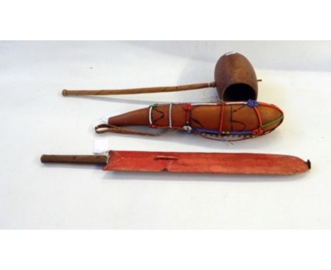 Tribal weapons to include three spears, edged weapon, machete in sheath, seed pod, water gourd and a cup (7) 